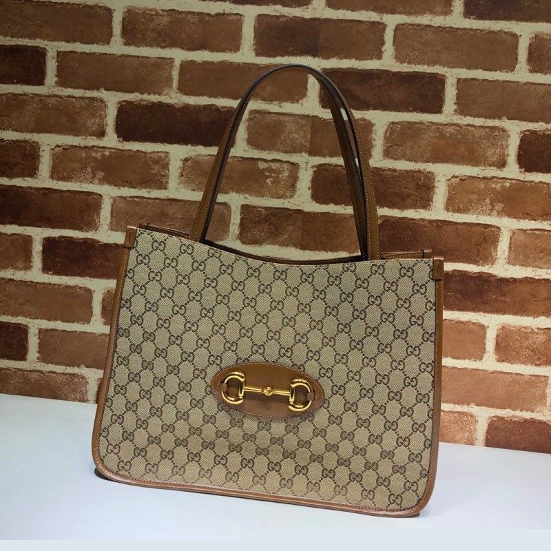 G*u*i shopping bags